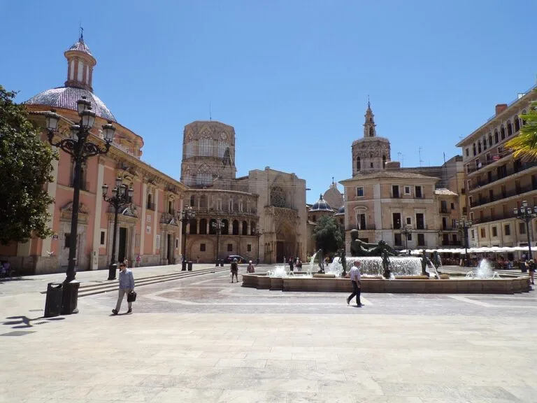 International students visiting Plaza de la Virgen with the Valencia Cathedral in Spain