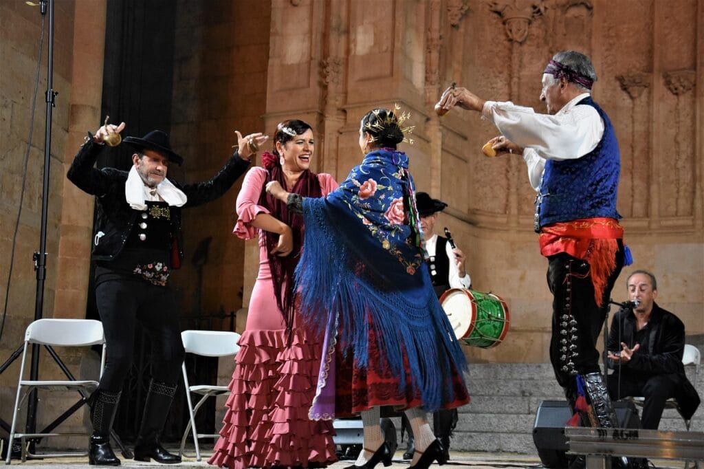 Traditional charros and gypsies dancing in Salamanca, symbolizing cultural friendship and community